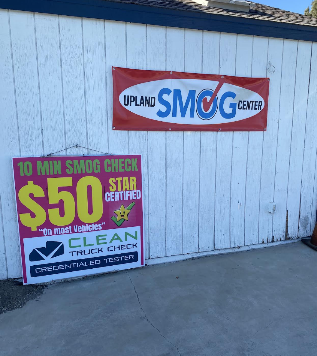 Upland Smog Center sign with a 10-minute smog check for $50 on most vehicles